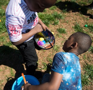 Josiah Young, 8, right, and Malachi Robinson, 7, look to see if they have all of the egg colors at the 9th Annual Easter Eggstravaganza at Lazy 5 Ranch on March 31, 2018. (Photo by Rebecca Benson)