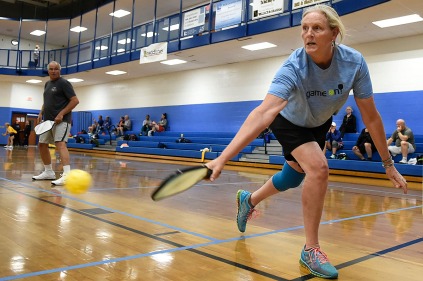 Jen Johnson, right, backhands the ball at JF Hurley YMCA's Pickleball Tournament on March 24, 2018. (Photo by Rebecca Benson)